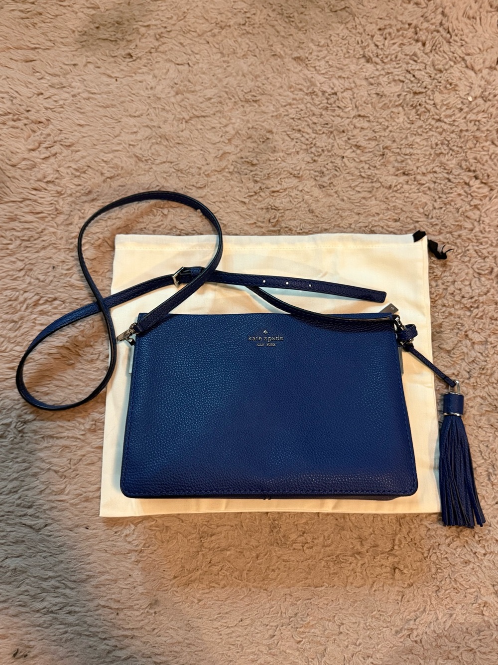 kate spade pebbled leather navy crossbody with tassel